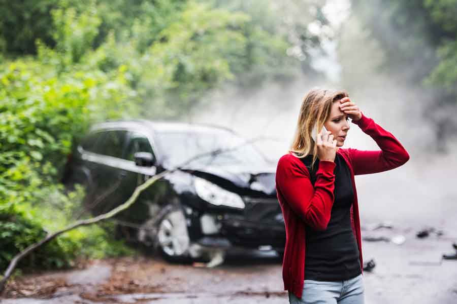 woman in red sweater after car wreck