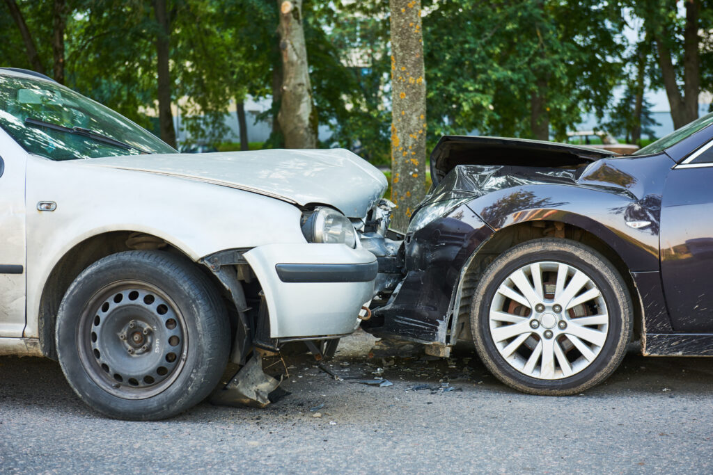 Two cars involved in a head on collision